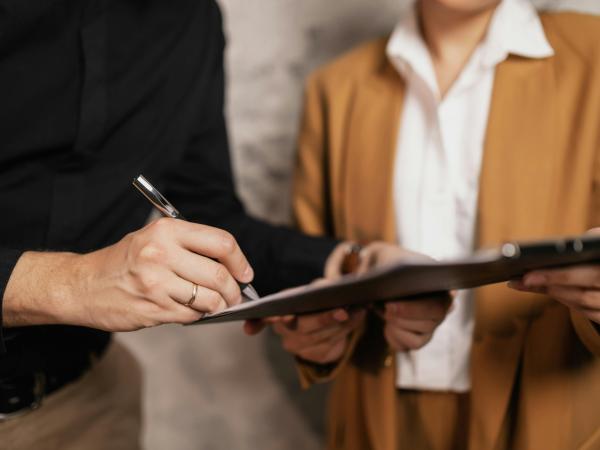 Person Signing a Document